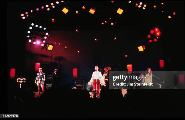 Keith Strickland, Fred Schneider and Kate Pierson of the rock and roll band the "B-52's" perform onstage in 1990 in Minnesota.