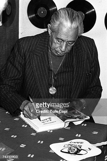 Big Band leader Cab Calloway signs autographs at the Village Music record store in 1983 in Mill Valley, California.