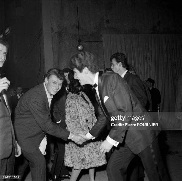 French singers Johnny Hallyday and Eddy Mitchell at the Palais des Sports for the first 'Night of Rock', Paris, 25th February 1961.