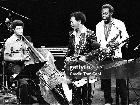 Jazz saxophonist Ornette Coleman performs onstage with fellow musicians in circa 1975.