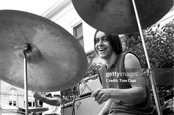 Drummer and student at the University of Michigan James Osterberg, Jr. Performs with his band The Prime Movers in the front garden of a house on...
