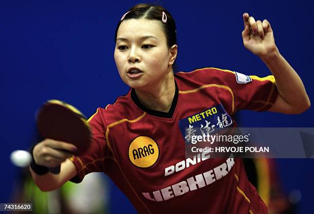 Wu Jiado of Germany returns a hit to Guo Yue of China during their qualifying match at the World Table Tennis Championships in Zagreb, 24 May 2007....