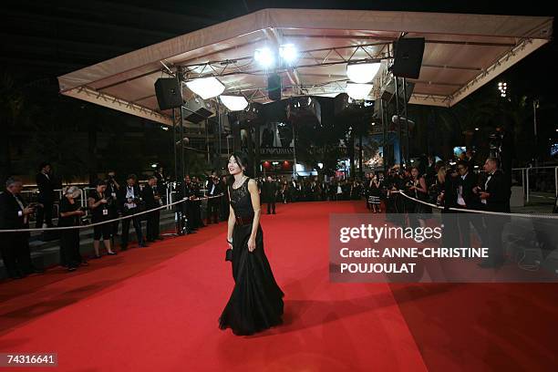 Member of the Jury, Chinese actress Maggie Cheung poses 24 May 2007 upon arriving at the Festival Palace in Cannes, southern France, for the premiere...