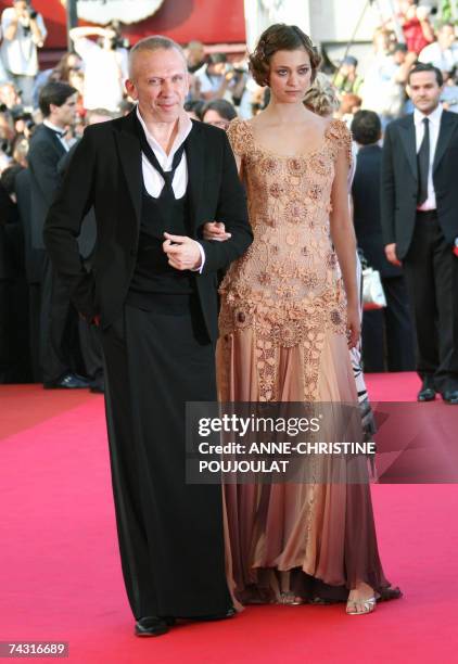 French fashion designer Jean-Paul Gaultier and an unidentified guest pose 24 May 2007 upon arriving at the Festival Palace in Cannes, southern...