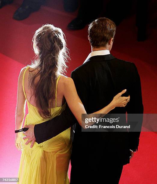 Actors Brad Pitt and Angelina Jolie depart the premiere for the film 'Ocean's Thirteen' at the Palais des Festivals during the 60th International...