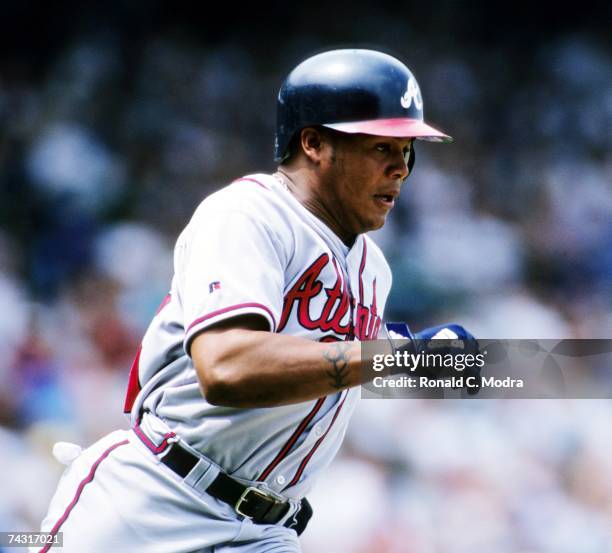 Andruw Jones of the Atlanta Braves running to first base during a game against the Chicago Cubs in Wrigley Field in May 1999 in Chicago, Illiinios.