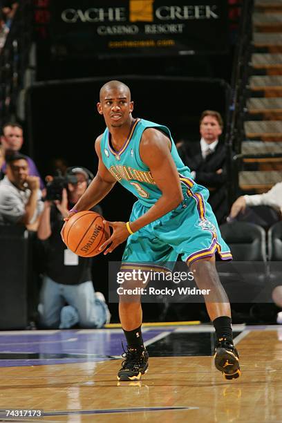 Chris Paul of the New Orleans/Oklahoma City Hornets looks to move the ball against the Sacramento Kings at Arco Arena on April 16, 2007 in...