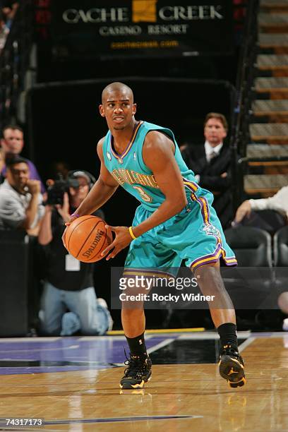 Chris Paul of the New Orleans/Oklahoma City Hornets looks to move the ball against the Sacramento Kings at Arco Arena on April 16, 2007 in...