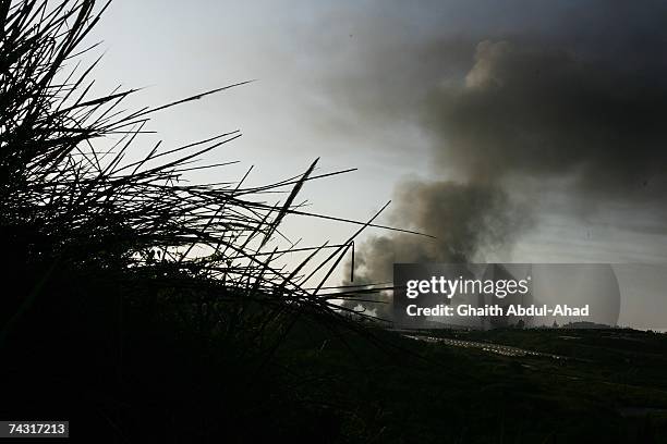 Smoke rises from the Palestinian refugee camp Nahr al-Bared, where the Lebanese army is fighting Islamic extremist group Fath el-Islam, on May 21,...