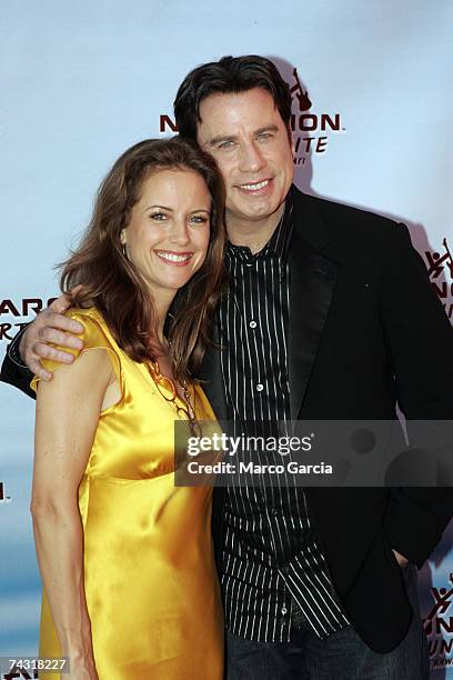 Kelly Preston and John Travolta arrive on the red carpet for a Fund-raiser for Narconon Hawaii at the Honolulu Design Center May 24, 2007 in...