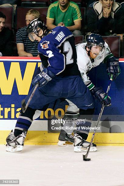 Michael Ward of the Lewiston Maineiacs body checks Dan Collins of the Plymouth Whalers during the tie breaker game of the 2007 Mastercard Memorial...