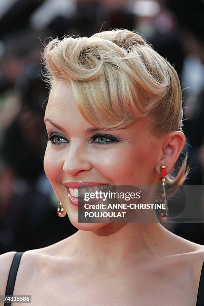 Australian singer Kylie Minogue poses 24 May 2007 upon arriving at the Festival Palace in Cannes, southern France, for the premiere of US director...