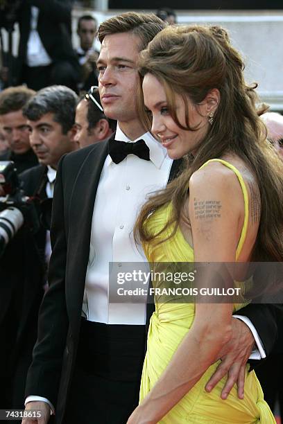 Actors Brad Pitt and Angelina Jolie pose 24 May 2007 upon arriving at the Festival Palace in Cannes, southern France, for the premiere of US director...