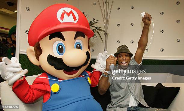 Ian Wright launches the first Wi-Fi game Mario Strikers Charged Football on Nintendo's Wii console at GAME Oxford Street on May 25, 2007 in London....