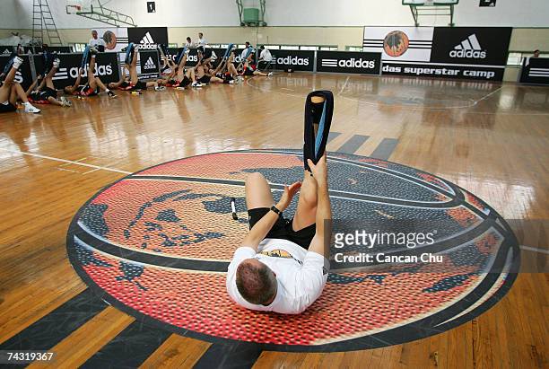 Coach Mark Verstegen gives a lesson to young players during The adidas Superstar Camp on May 25, 2007 at the Shanghai Sports University in China. The...