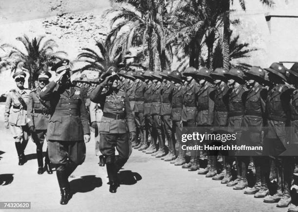 German military commander Erwin Rommel and Italian General Italo Gariboldi inspect the German troops in Africa during World War II, 21st April 1941.