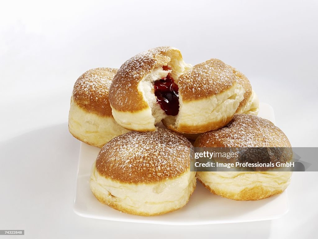 Five doughnuts on a serving plate