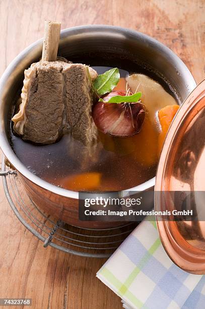 broth with beef and soup vegetables in pot - bollito foto e immagini stock