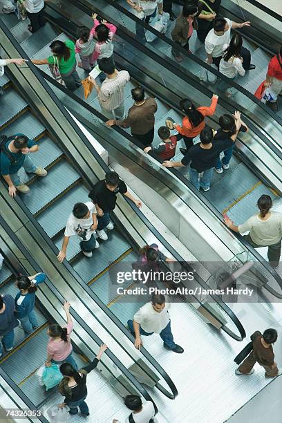 shopping mall escalators, high angle view - shopping centre escalator stock pictures, royalty-free photos & images