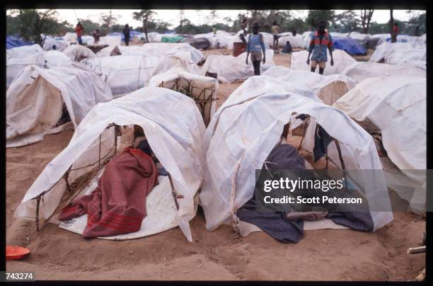 Sudanese refugees and "Lost Boys" sleep in tents on June 18, 1992 at a camp inside Kenya. Some 17,000 boys were lured away from home to receive...