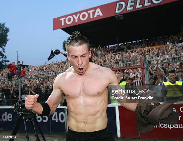 Marvin Braun of St. Pauli celebrates his team's promotion to the Second League after the Third League Northern Division match between FC St.Pauli and...