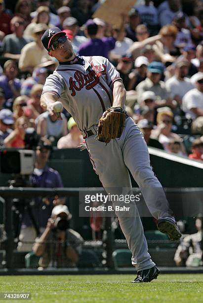 Third baseman Chipper Jones of the Atlanta Braves throws out Jamey Carroll of the Colorado Rockies on a bunt in the sixth inning on April 29, 2007 at...