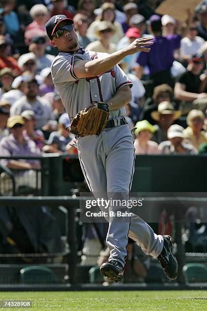 Third baseman Chipper Jones of the Atlanta Braves throws out Jamey Carroll of the Colorado Rockies on a bunt in the sixth inning on April 29, 2007 at...