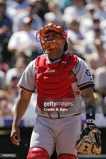 Catcher Brayan Pena of the Atlanta Braves works behind the plate against the Colorado Rockies in the third inning on April 29, 2007 at Coors Field in...