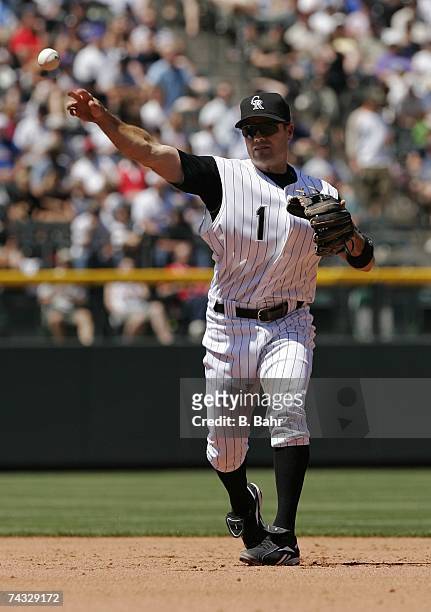 Second baseman Jamey Carroll of the Colorado Rockies throws out Kyle Davies of the Atlanta Braves at first base in the third inning on April 29, 2007...