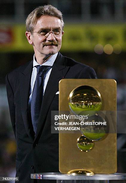 Longeville-les-Metz, FRANCE: Frederic Thiriez, president of LFP, is pictured beside the L2 trophy after Metz won the French L2 football match at...