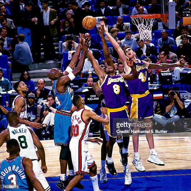 Kobe Bryant of the Western Conference battles for a rebound against the Eastern Conference during the 1997 Rookie All-Star game played February 8,...