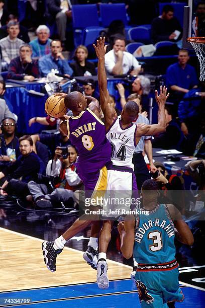 Kobe Bryant of the Western Conference drives to the basket against Ray Allen of the Eastern Conference during the 1997 Rookie Game played February 8,...