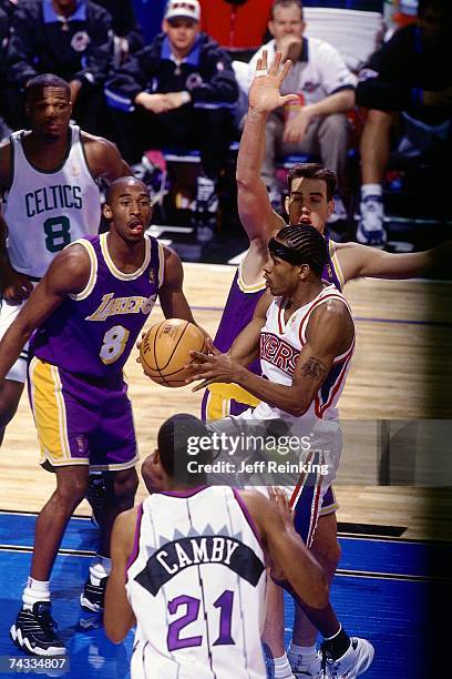 Allen Iverson of the Eastern Conference drives to the basket against Kobe Bryant of the Western Conference during the 1997 Rookie Game played...