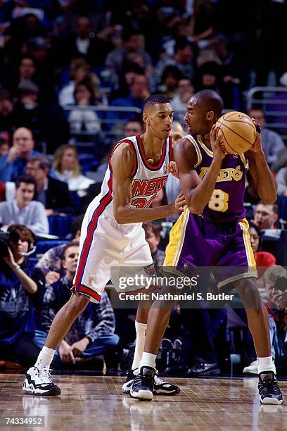 Kobe Bryant of the Western Conference posts up against Kerry Kittles of the Eastern Conference during the 1997 Rookie Game played February 8, 1997 at...