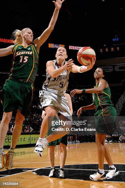 Shanna Crossley of the San Antonio Silver Stars shoots against Lauren Jackson of the Seattle Storm during the game at the AT&T Center on May 25, 2007...