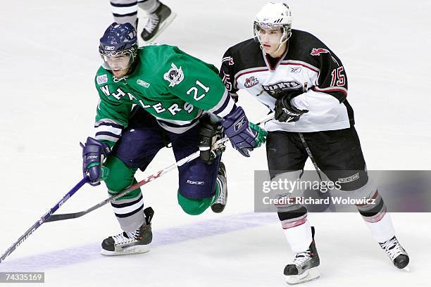 Tom Sestito of the Plymouth Whalers tries to get past Spencer Machacek of the Vancouver Giants during the Semifinal game of the 2007 Mastercard...