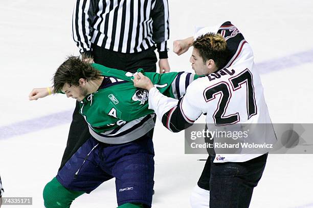 Milan Lucic of the Vancouver Giants punches Jared Boll of the Plymouth Whalers during the Semifinal game of the 2007 Mastercard Memorial Cup...