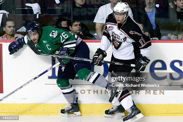 Watt of the Vancouver Giants body checks Steve Ward of the Plymouth Whalers during the Semifinal game of the 2007 Mastercard Memorial Cup...