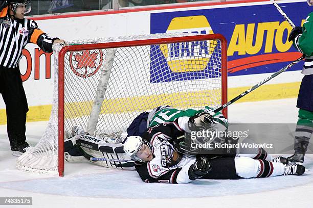Watt of the Vancouver Giants is called for interference on Jeremy Smith of the Plymouth Whalers during the Semifinal game of the 2007 Mastercard...