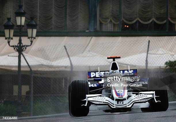 Nick Heidfeld of Germany and BMW Sauber drives through Casino Square in the warm up session prior to qualifying for the Monaco Formula One Grand Prix...