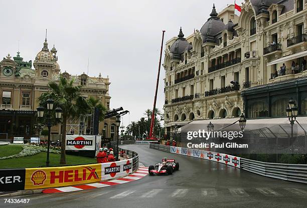 Lewis Hamilton of Great Britain and McLaren Mercedes drives through Casino Square in the warm up session prior to qualifying for the Monaco Formula...