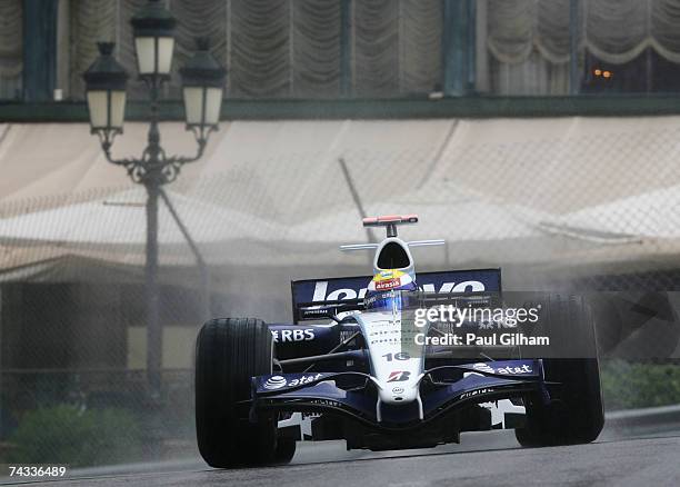 Nico Rosberg of Germany and Williams drives through Casino Square in the warm up session prior to qualifying for the Monaco Formula One Grand Prix at...