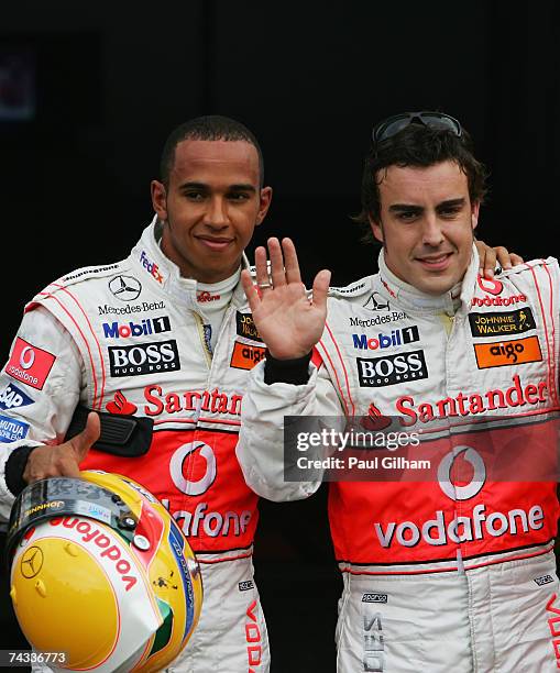 Fernando Alonso of Spain and McLaren Mercedes celebrates taking pole position with team mate Lewis Hamilton of Great Britain who qualified second...