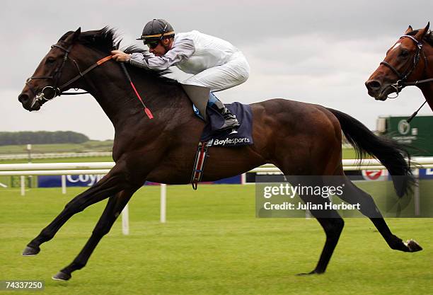 Olivier Peslier and Cockney Rebel lead the field home to land The Boylesports Irish 2000 Guineas Race run at The Curragh Racecourse on May 26 in The...