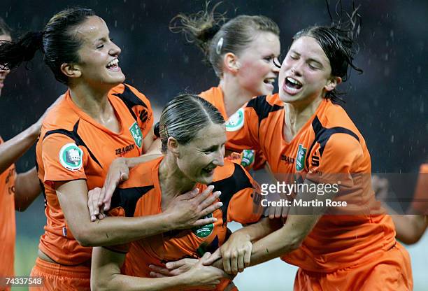 Sonja Fuss celebrates with her Duisburg teammates after she scores the first goal for her team during the Women's DFB German Cup final between 1.FFC...