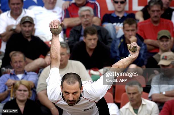 French traditional Lyon's lawn bowling player, Noel Saint-Jores, throws a boule, 26 May 2007 in Lyon, on the first day of the 95th edition of Lyon...