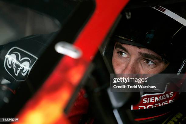 Elliott Sadler, driver of the Dodge Dealers/UAW Dodge, sits in his car prior to practice for the NASCAR Nextel Cup Series Coca-Cola 600 on May 26,...