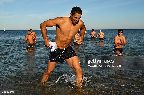 Greg Inglis of the Storm leads the team out of the Port Phillip Bay during the Melbourne Storm Recovery session at the St Kilda Sea Baths May 27,...