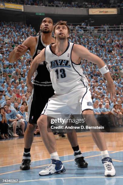 Mehmet Okur of the Utah Jazz fights for position against Tim Duncan of the San Antonio Spurs in Game Three of the Western Conference Finals during...
