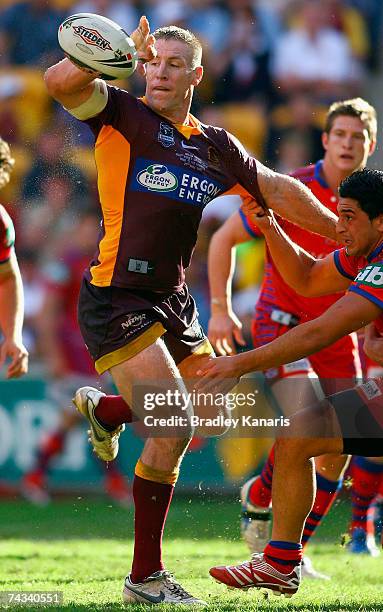 Brad Thorn of the broncos gets a pass away during the round 11 NRL match between the Brisbane Broncos and the Newcastle Knights at Suncorp Stadium on...